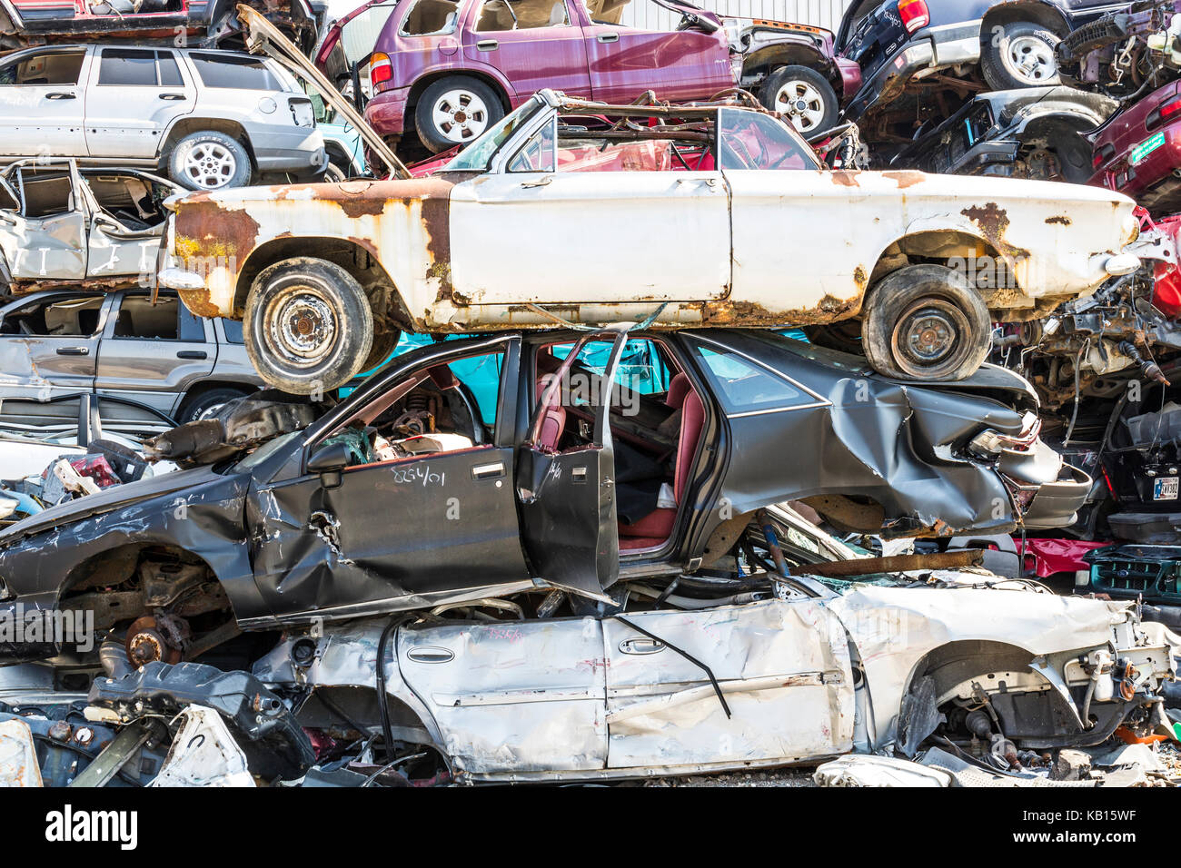 Indianapolis Circa September 2017 Stacked junk yard clunker cars