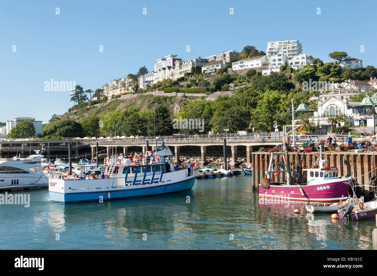 Pleasure boat full of tourists from Dartmouth comes in to dock in the