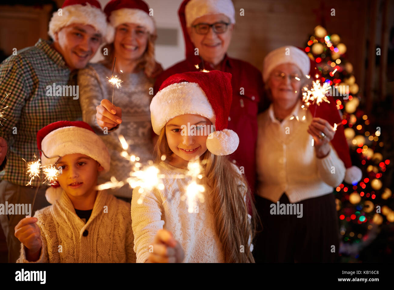 happy family with sparklers celebrate Christmas eve Stock Photo Alamy