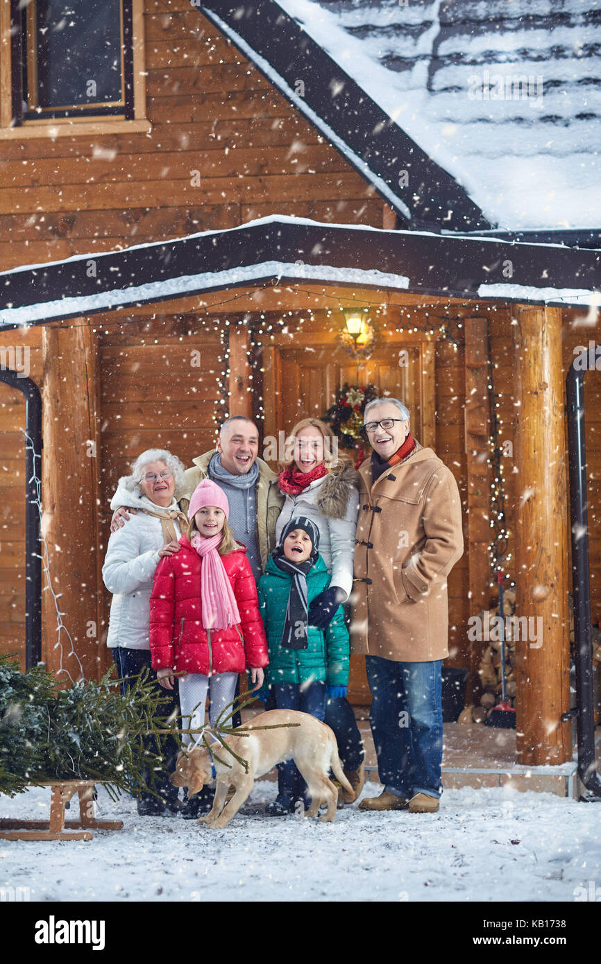 Portrait of smiling family outdoor on Christmas Eve Stock Photo - Alamy