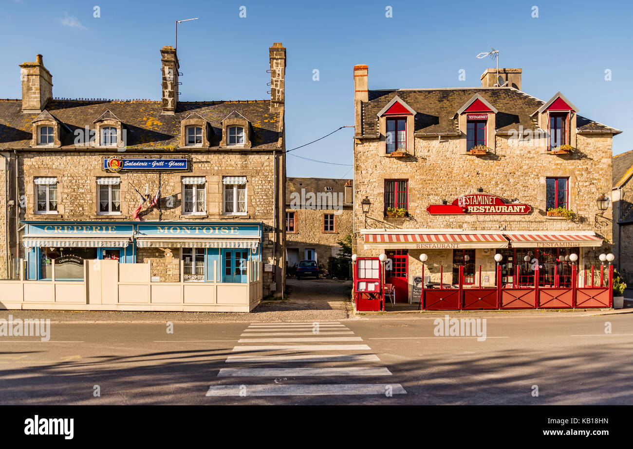 SAINTE MARIE DU MONT - APRIL 5: street and old Building on April 5, 2015 in Sainte Marie du Mont, Manche, Normandy, France Stock Photo