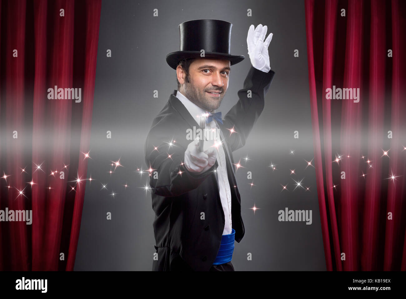 Magician  in costume showing spectacular trick Stock Photo
