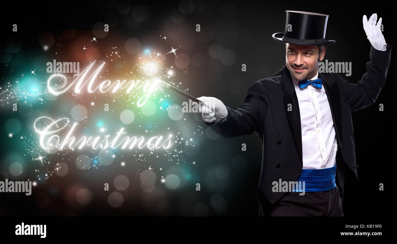 magician with a Christmas magic, trick for Merry Christmas Stock Photo Christmas Magician