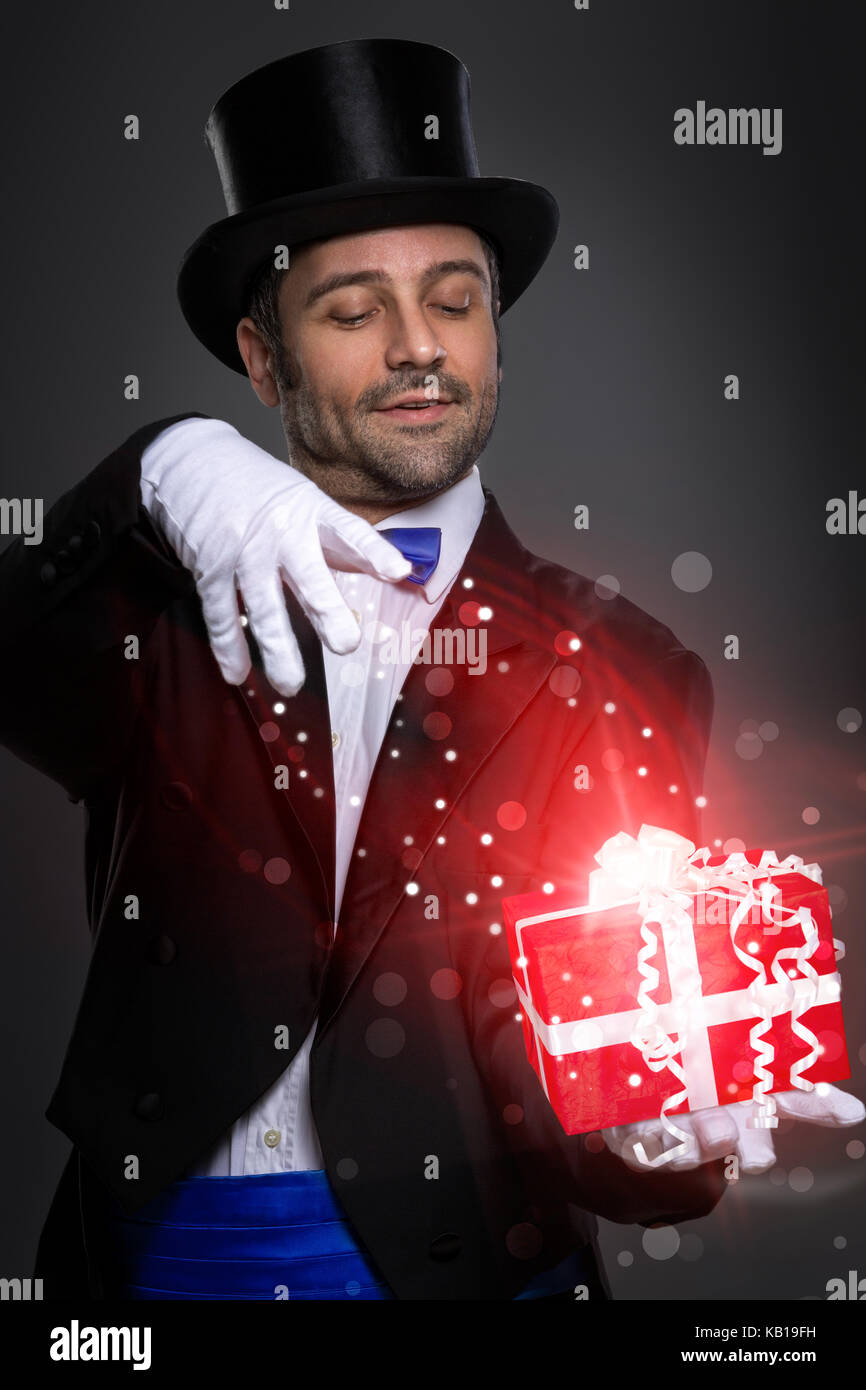 magician performs the trick with magic gift Stock Photo Alamy