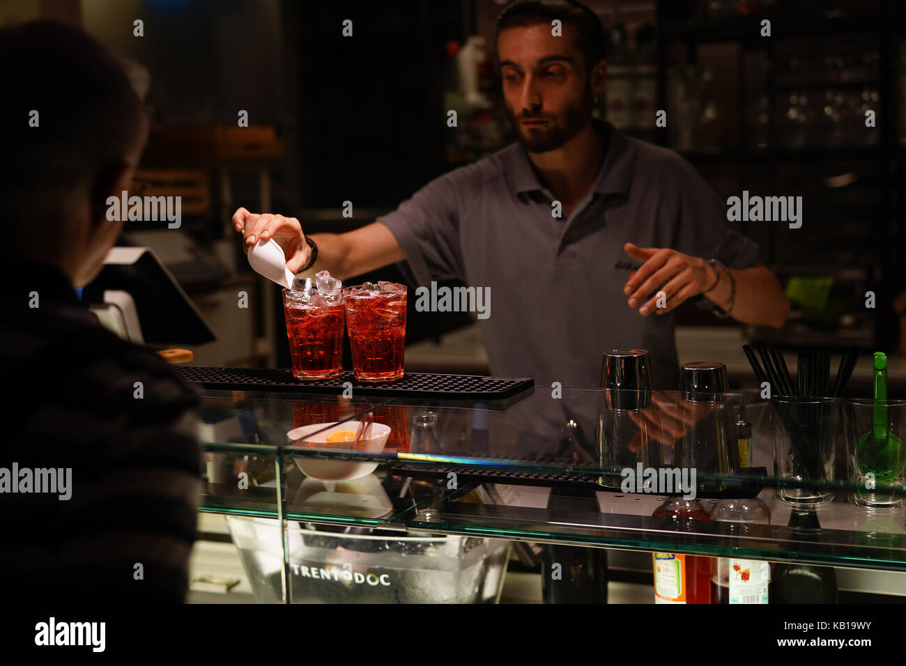 A bar tender serves two traditional spritzer drinks in Bologna. From a series of travel photos in Italy. Photo date: Friday, September 15, 2017. Photo Stock Photo