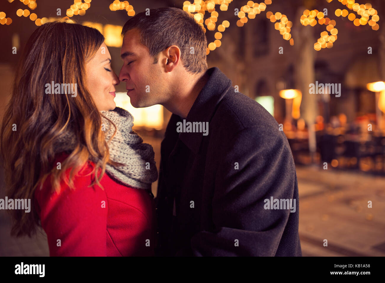 Young couple kissing on street hi-res stock photography and images - Alamy