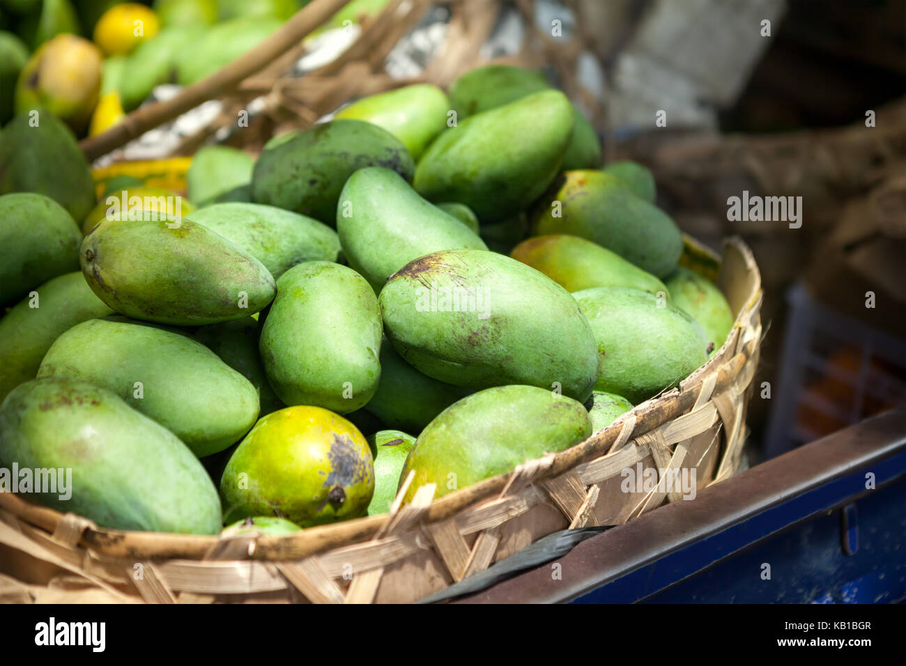 Basket full of fresh green papaya Stock Photo - Alamy