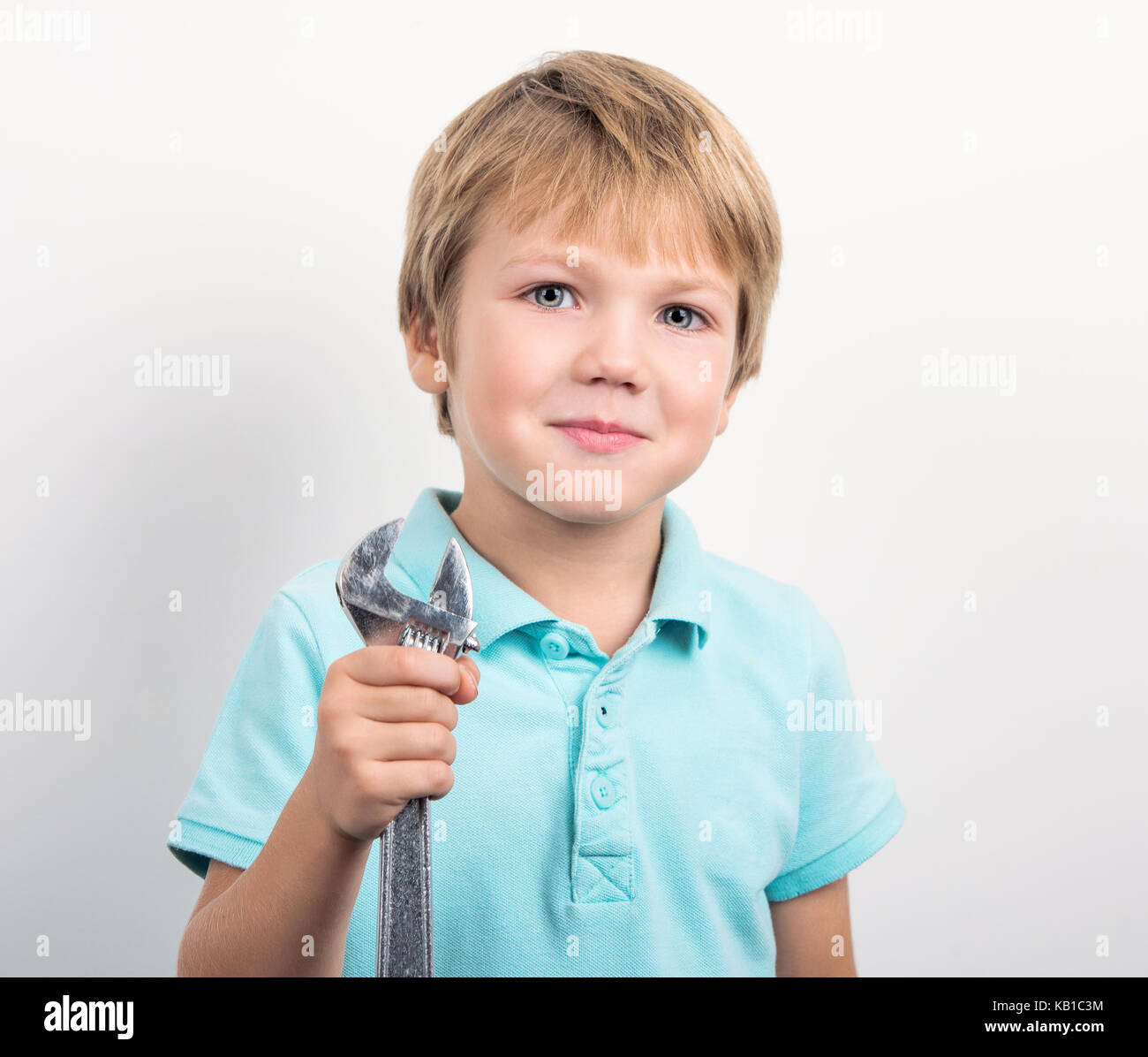 little boy with a wrench Stock Photo Alamy
