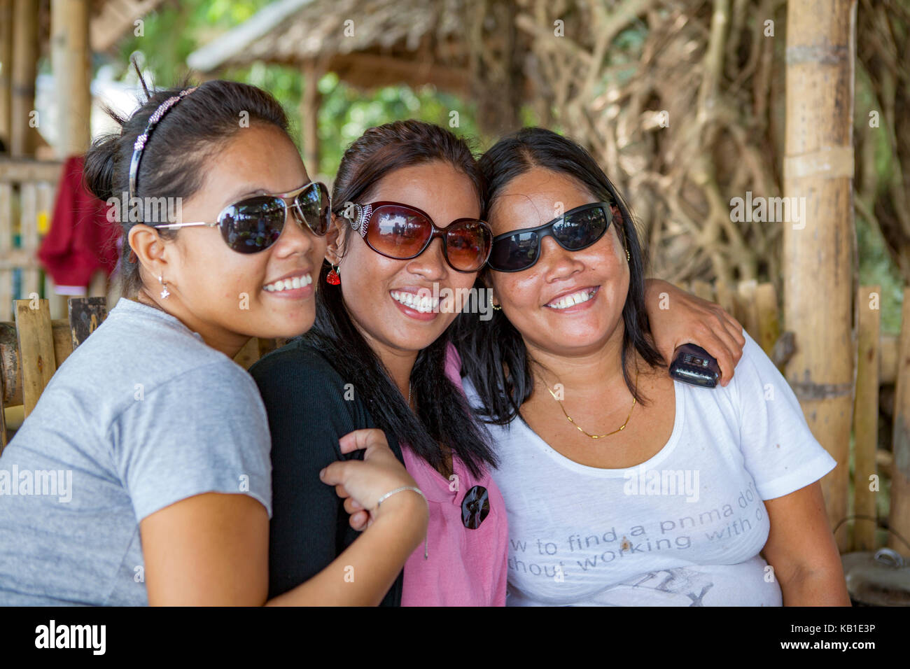 Portrait of Filipino sisters with their mother in Ormoc City, Leyte Island, Philippines. Stock Photo