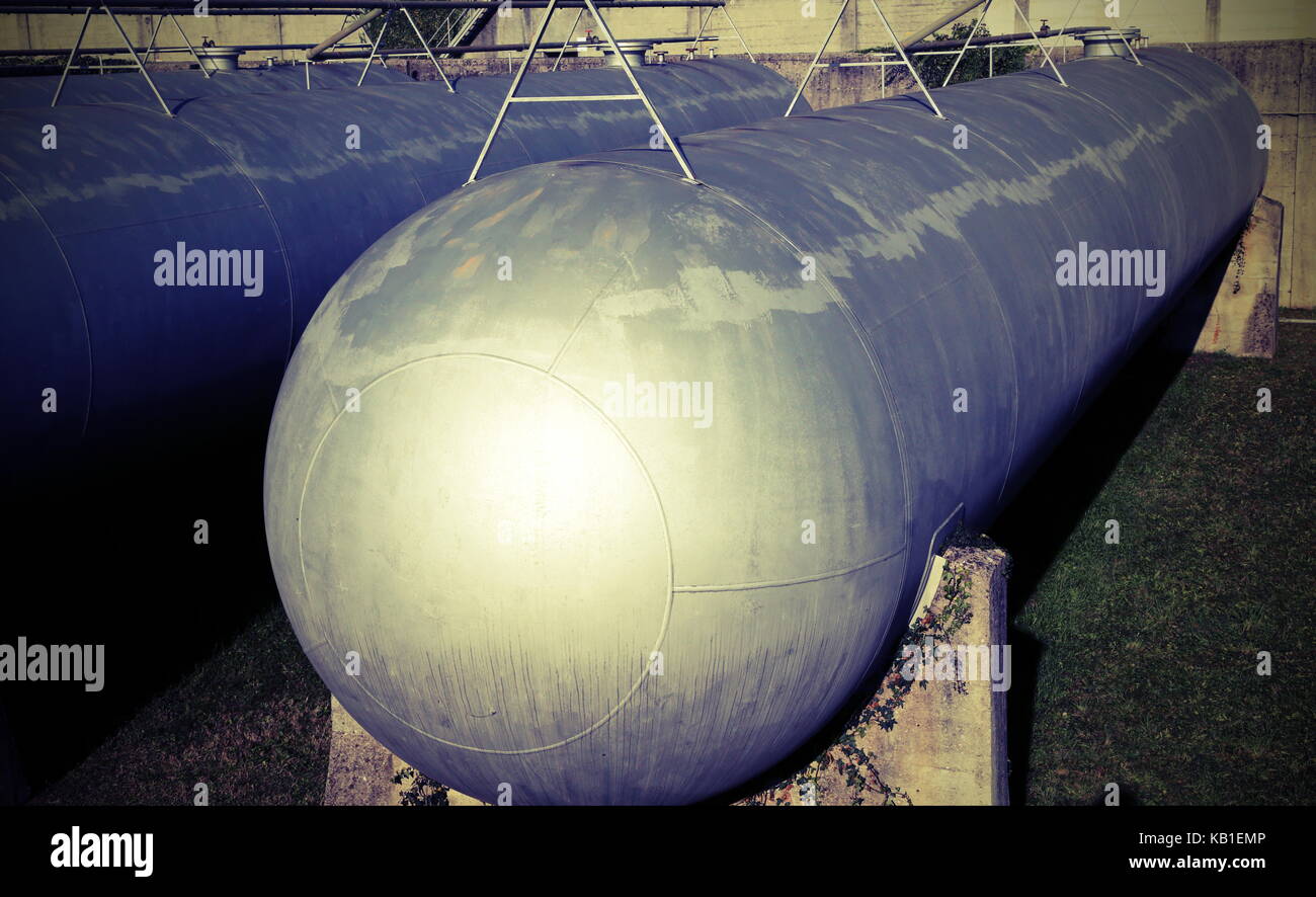 Huge gas storage tanks in an industrial area. Large cylinders are used
