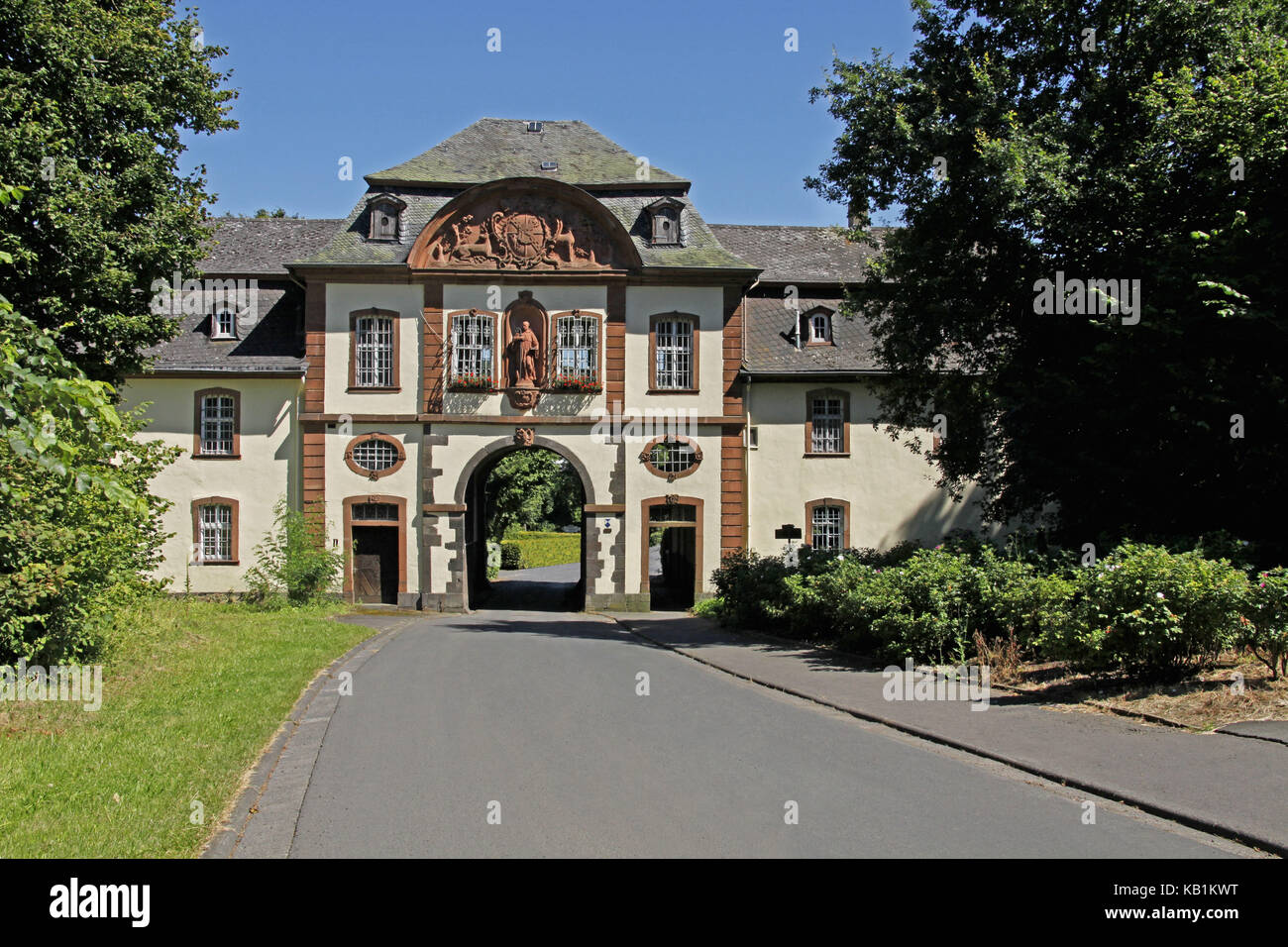 Germany, Hessia, Arnsberg near Lich, upper Hessians, Wetteraukreis, ruin of a former Benedictine abbey, baroque Pforthaus, established by father Cölestin Wagner, abbot coat of arms, statue of holy Bernhard von Clairvaux, access to the abbey courtyard, Stock Photo