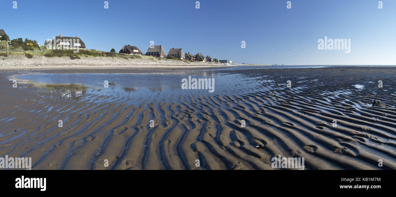 Thatched-roof houses by the North Sea at low tide, List, Sylt island, Schleswig - Holstein, Germany, Stock Photo