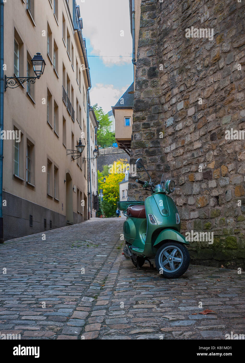 Green scooter and old, historical street from Old Luxembourg Stock Photo