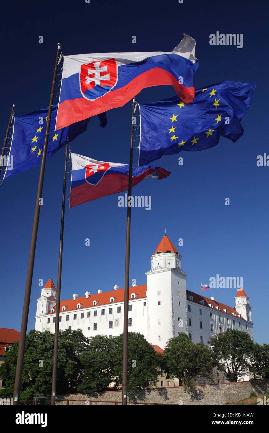 Castle of Bratislava, Slovakia, with flags of the Slovakian republic and Europe, Stock Photo