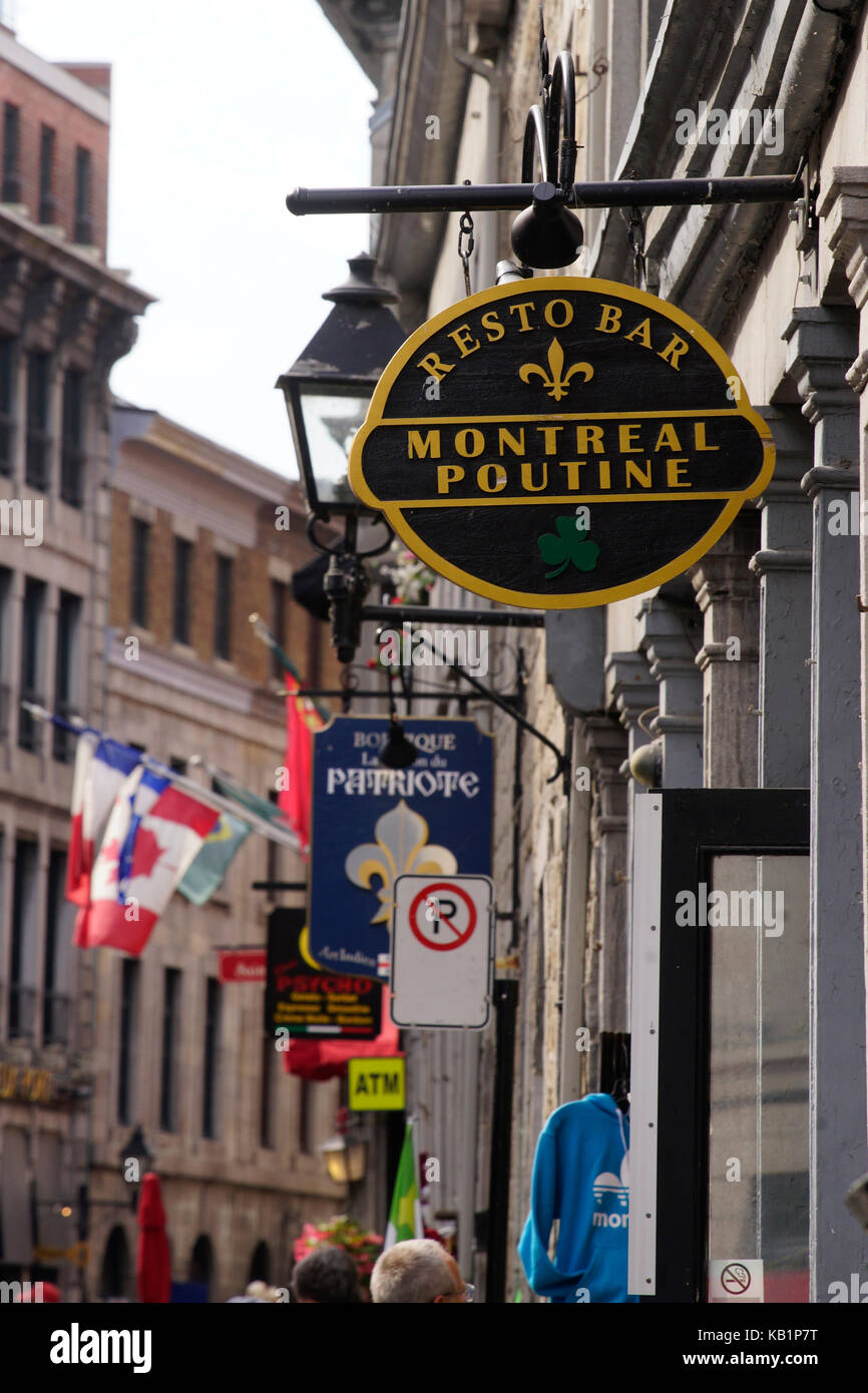 Shops and restaurant signs along St-Paul street in Old Montreal Stock Photo