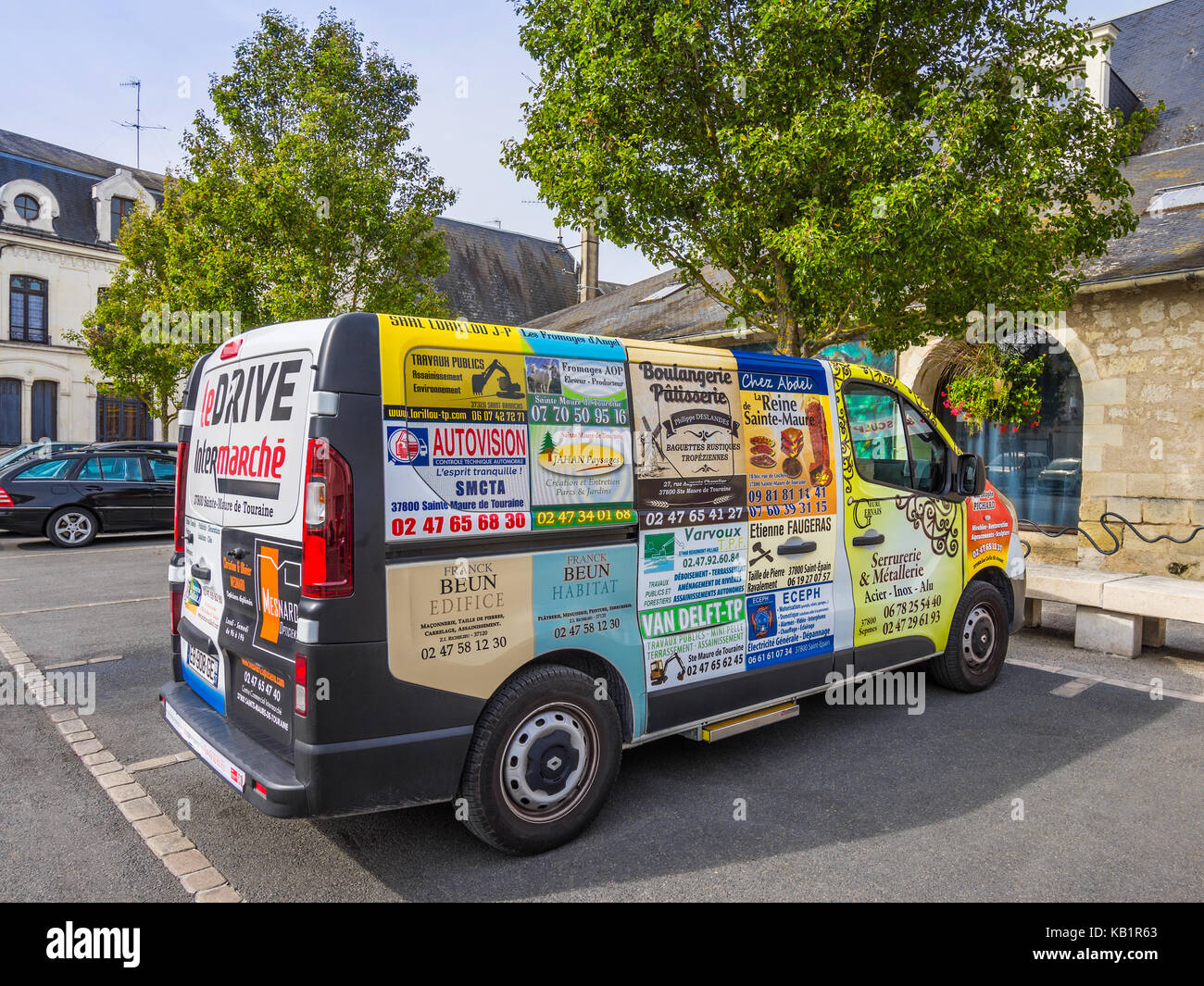Transit van covered in advertising publicity panels - France. Stock Photo