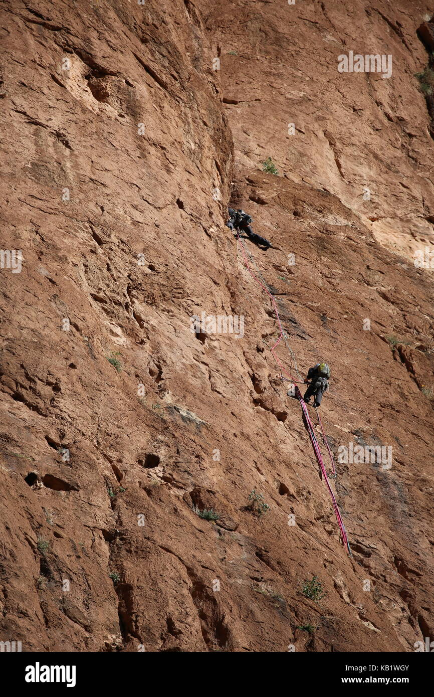 Climber at a rock in Morocco --- Bergsteiger an einem Felsen in Marokko Stock Photo