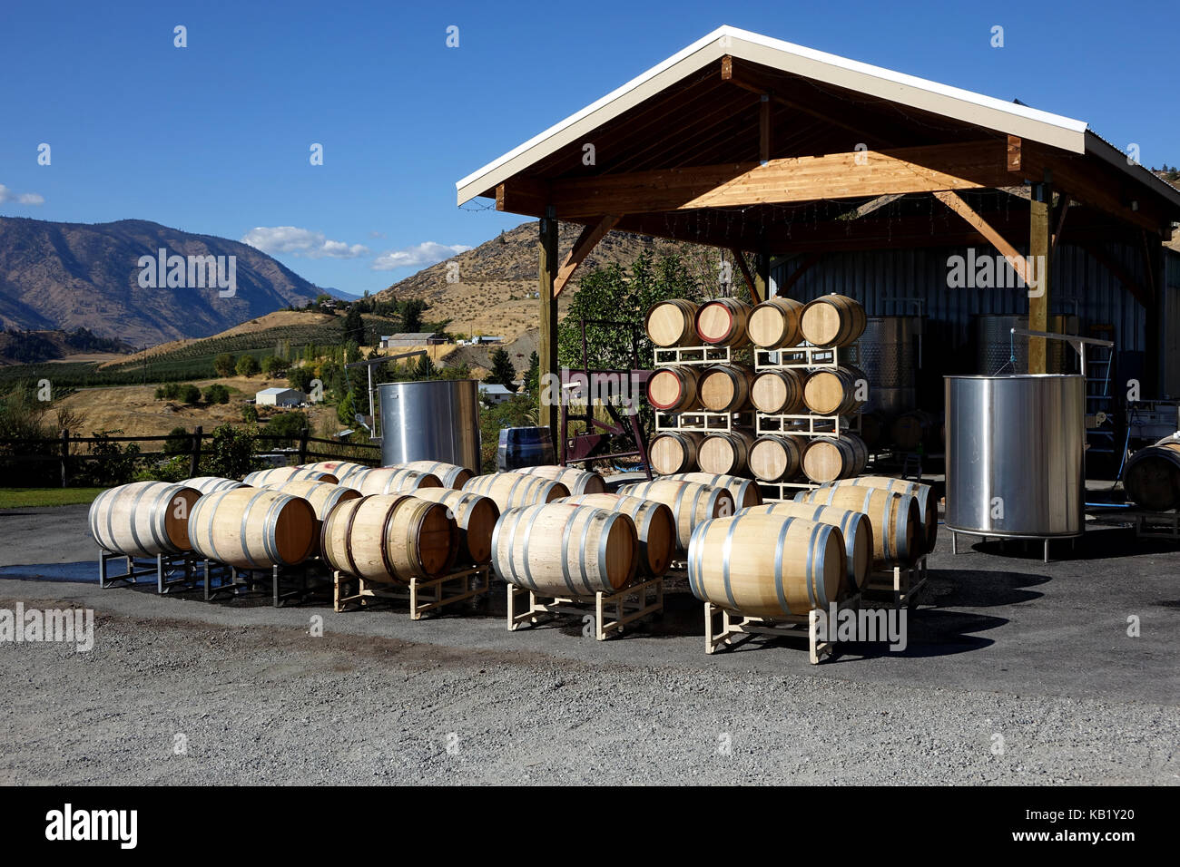 Old and new wine barrels receive a good interior washing before being used to ferment wine. Stock Photo