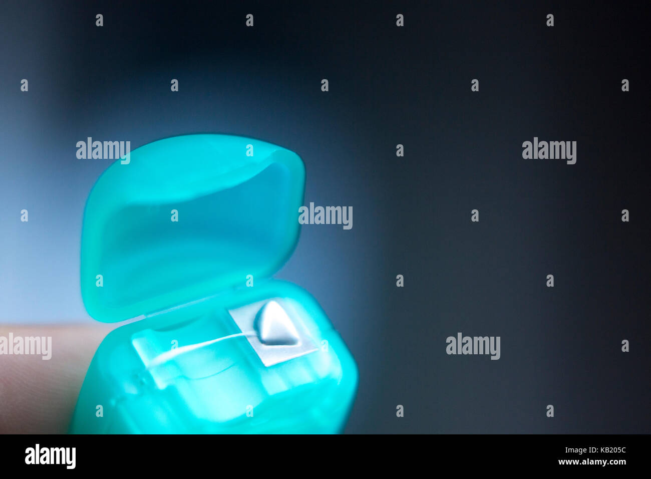 Dental floss tape closeup on plain background Stock Photo Alamy