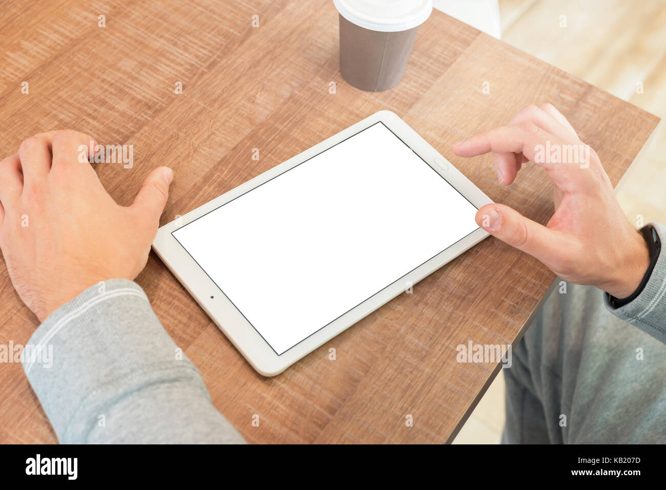 Guy touch tablet display. Isolated blank screen for mockup. Stock Photo