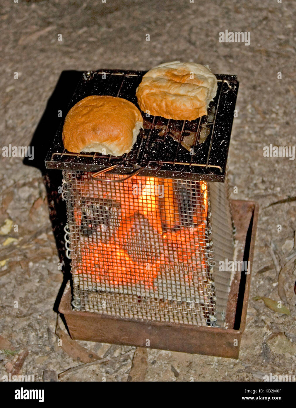 Bread being toasted in fire hires stock photography and images Alamy