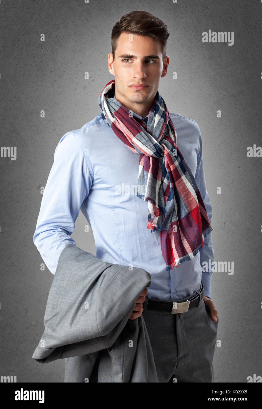 Cool businessman standing over grunge wall Stock Photo