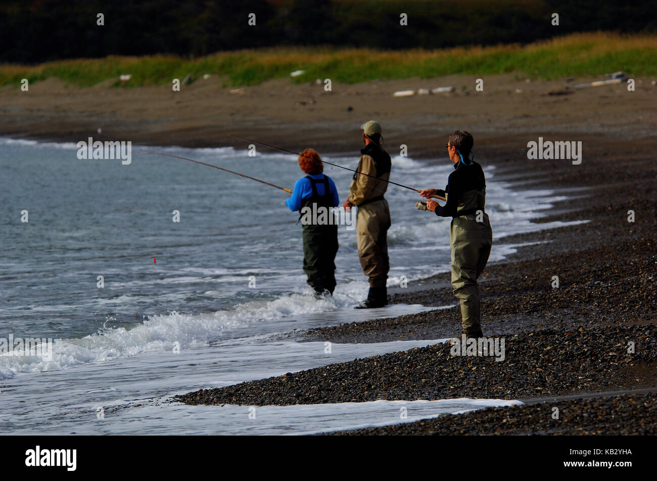Angler fishing with a spinning rod for trout and salmon near Chignik