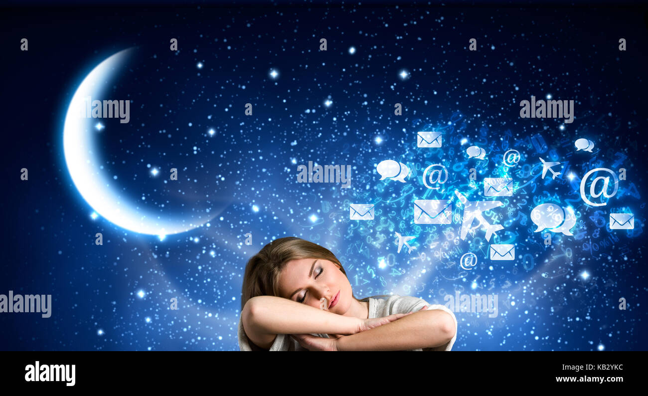 Young girl sleeping surrounded by abstract elements of her dreams Stock Photo