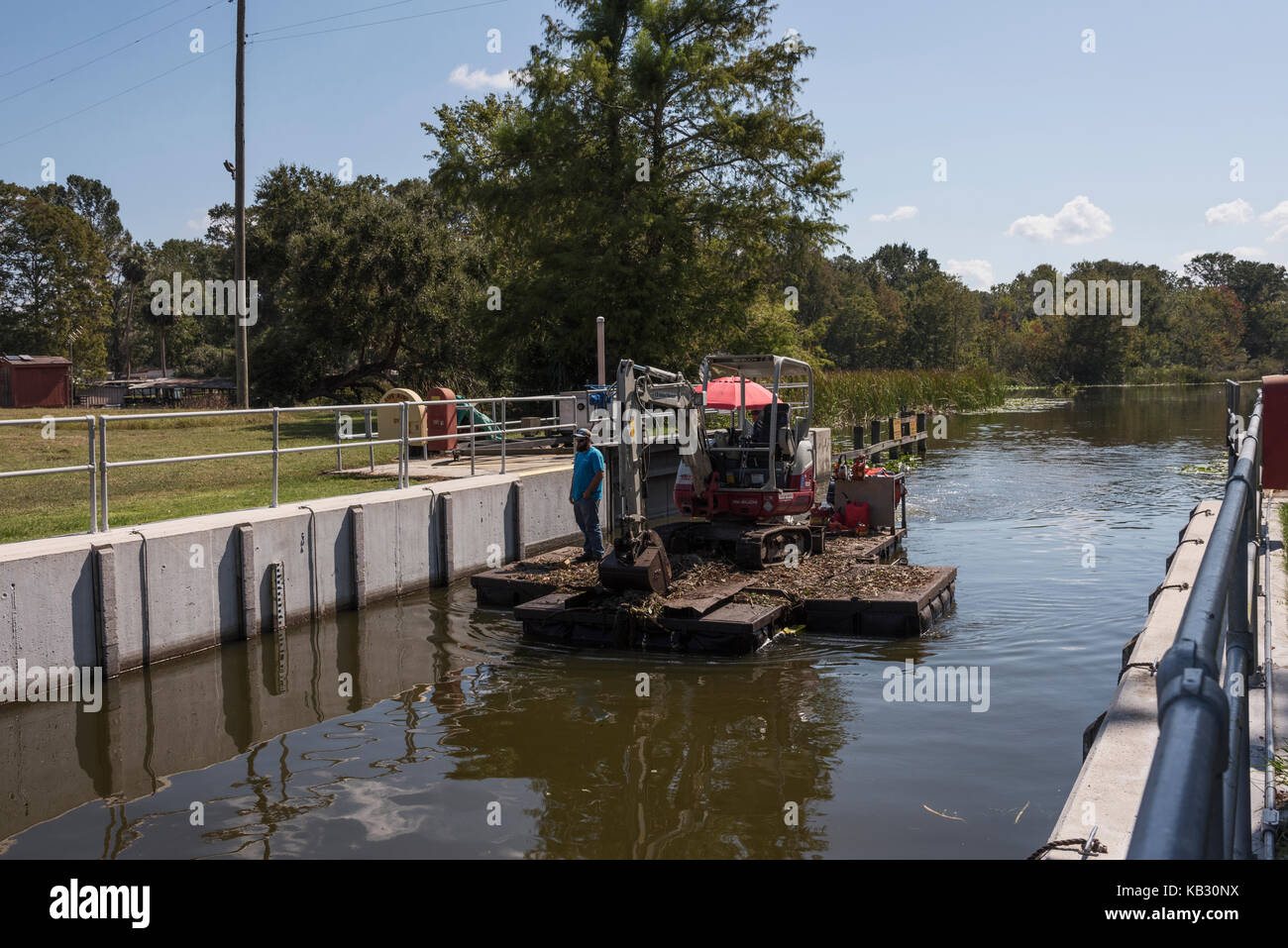After Hurricane Irma, Tree Cleanup crew locking through the Burrell Navigational Lock on Haines Creek Leesburg, Florida USA Stock Photo