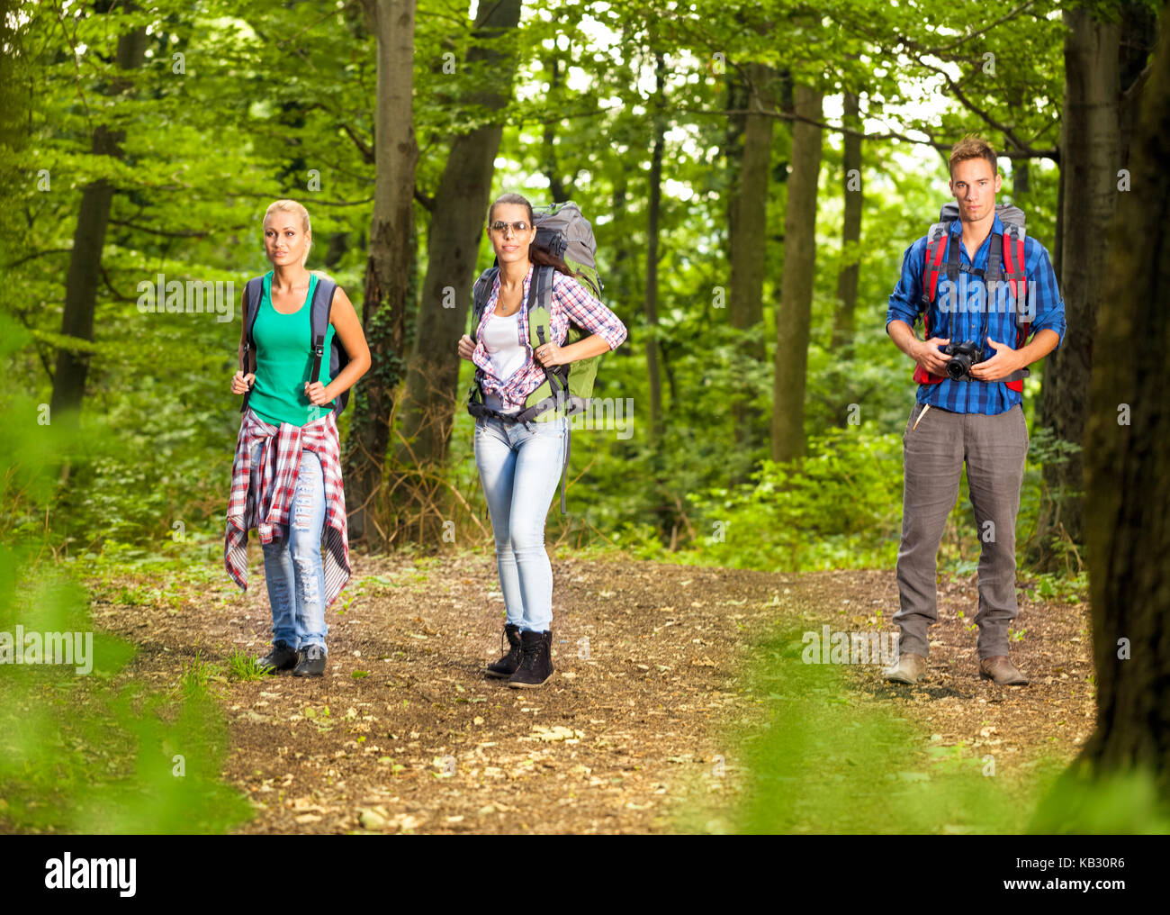 young people walking in forest Stock Photo - Alamy