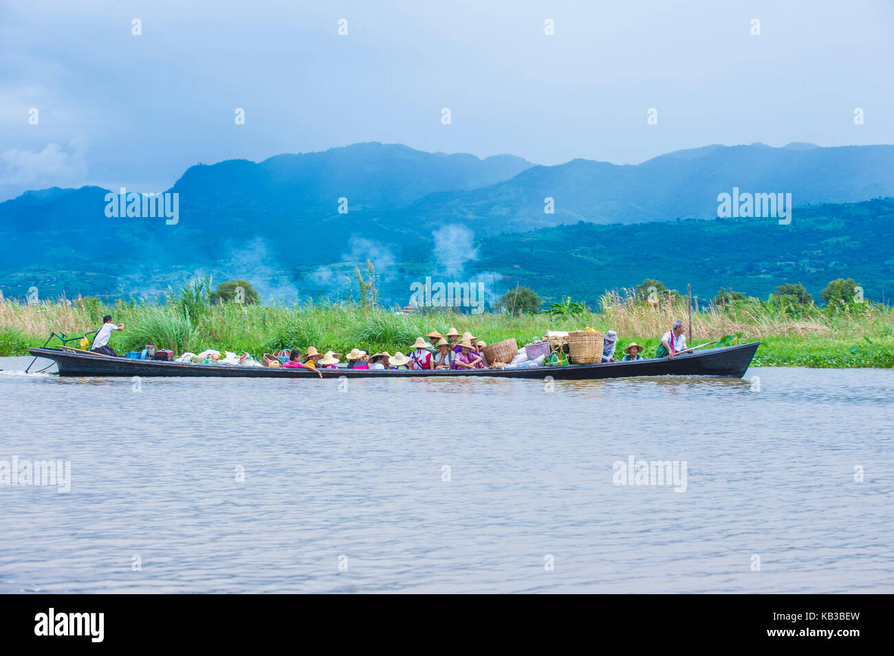 Intha people on a boat in Inle lake Myanmar Stock Photo - Alamy