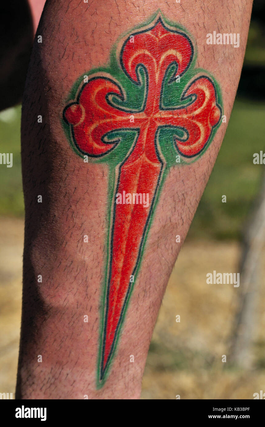 Way of St. James, Bein-Tatoo of a Portuguese jacobean pilgrim while red sword cross of the Santiago knights, Stock Photo