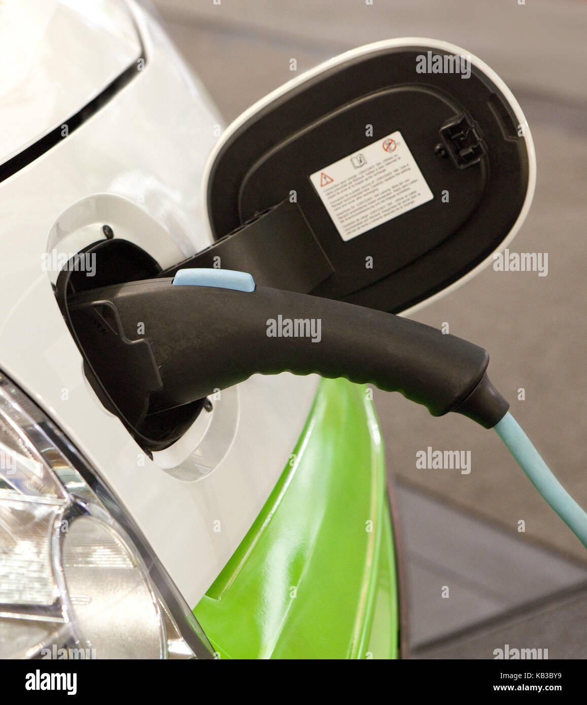 Electric car, charge, medium close-up, biotank, sprite, green, future, biology, icon, biodiesel, bioboom, biosprite, biotank, current, electronically, elektro, electromobile, car, vehicle, ecologically, green future, green energy, Zukufnt, cleanly, clean, load, environmentally friendly, refuel, energy, E car, Co2 Auststoß, environmental balance, car, demand, passenger car, autospring, anew, new, trendy, trend, Nullemmision, issue, current demand, current eater, power consumption, immensely, shocking, high, tank filling, Stock Photo