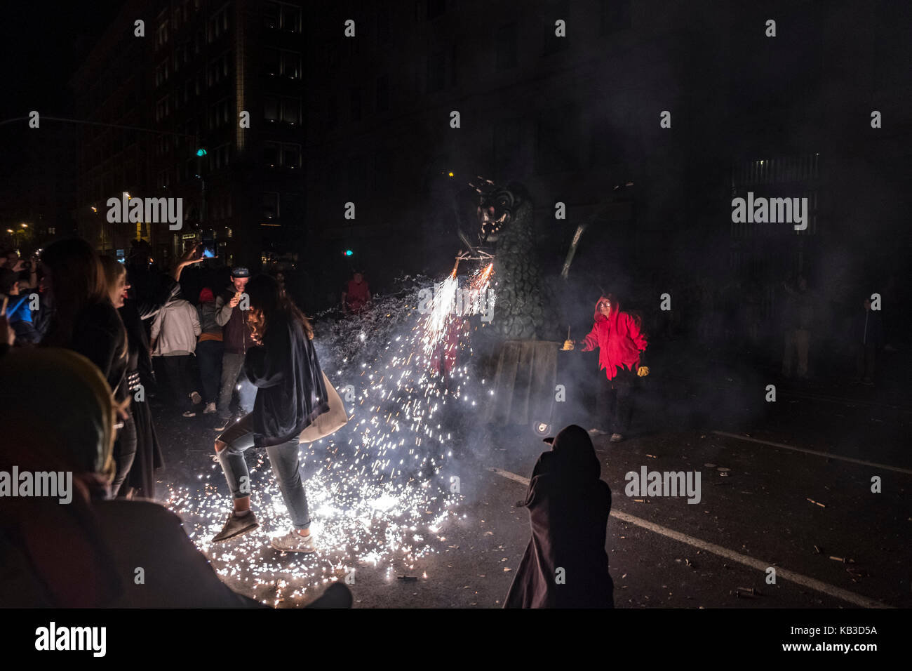 Correfocs are among the most striking features present in Catalan festivals. In the correfoc, a group of individuals will dress as devils. Stock Photo