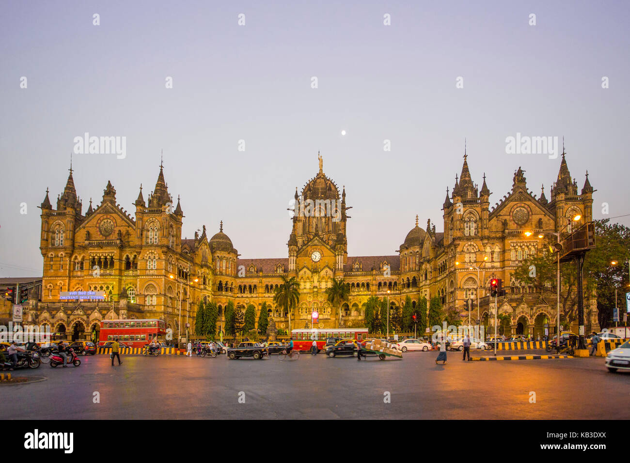 India, Maharastra, Mumbai, Bombay, Dadabhai Naoroji street and Victoria Station (Chatrapati Shivaji terminal), Sunset Stock Photo