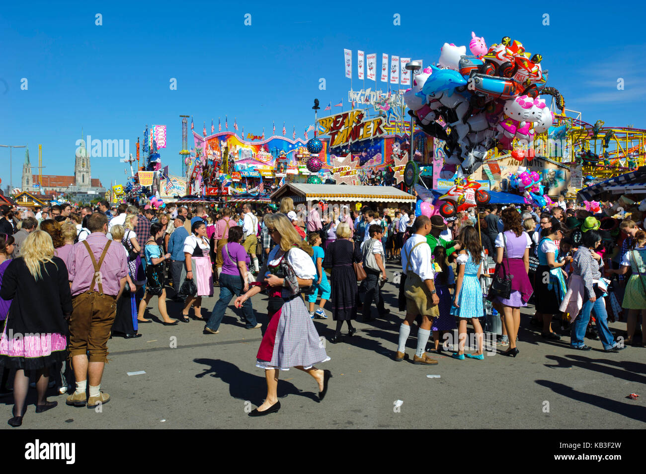 Oktoberfest in Munich, visitor on the streets in front of the beer tents and amusement rides, Stock Photo