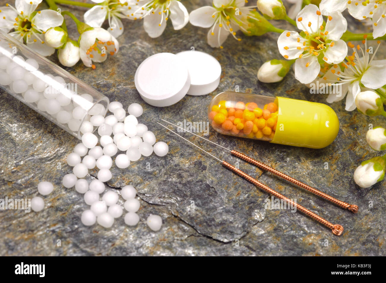 Alternative medicine with Globuli and acupuncture, Stock Photo