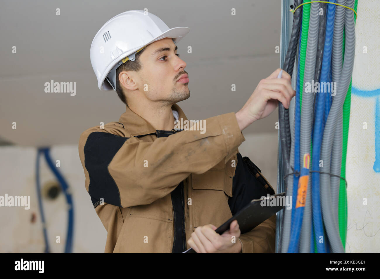 lineman inspecting the lines of cables Stock Photo - Alamy