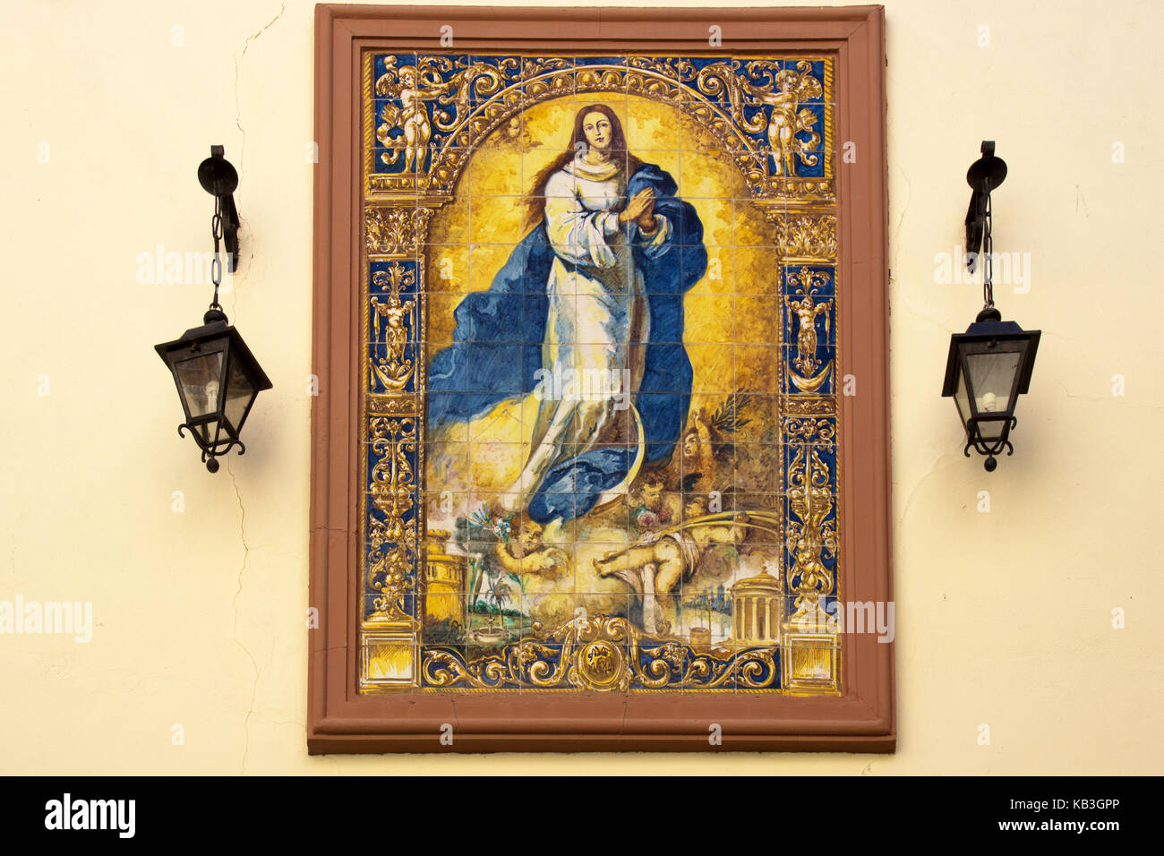 SEVILLE, SPAIN - MARCH 15, 2014: The ceramic tiled Inmaculada Concepción de Nuestra Señora by Desconocido in 1920. Manufactured by Nuestra Señora del  Stock Photo
