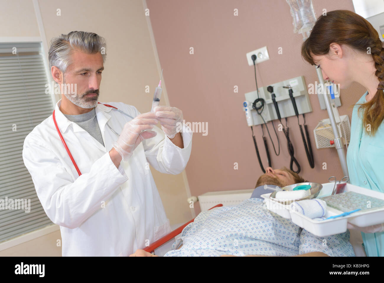 doctor raedy ti give injured man tetanus toxoid injection Stock Photo ...
