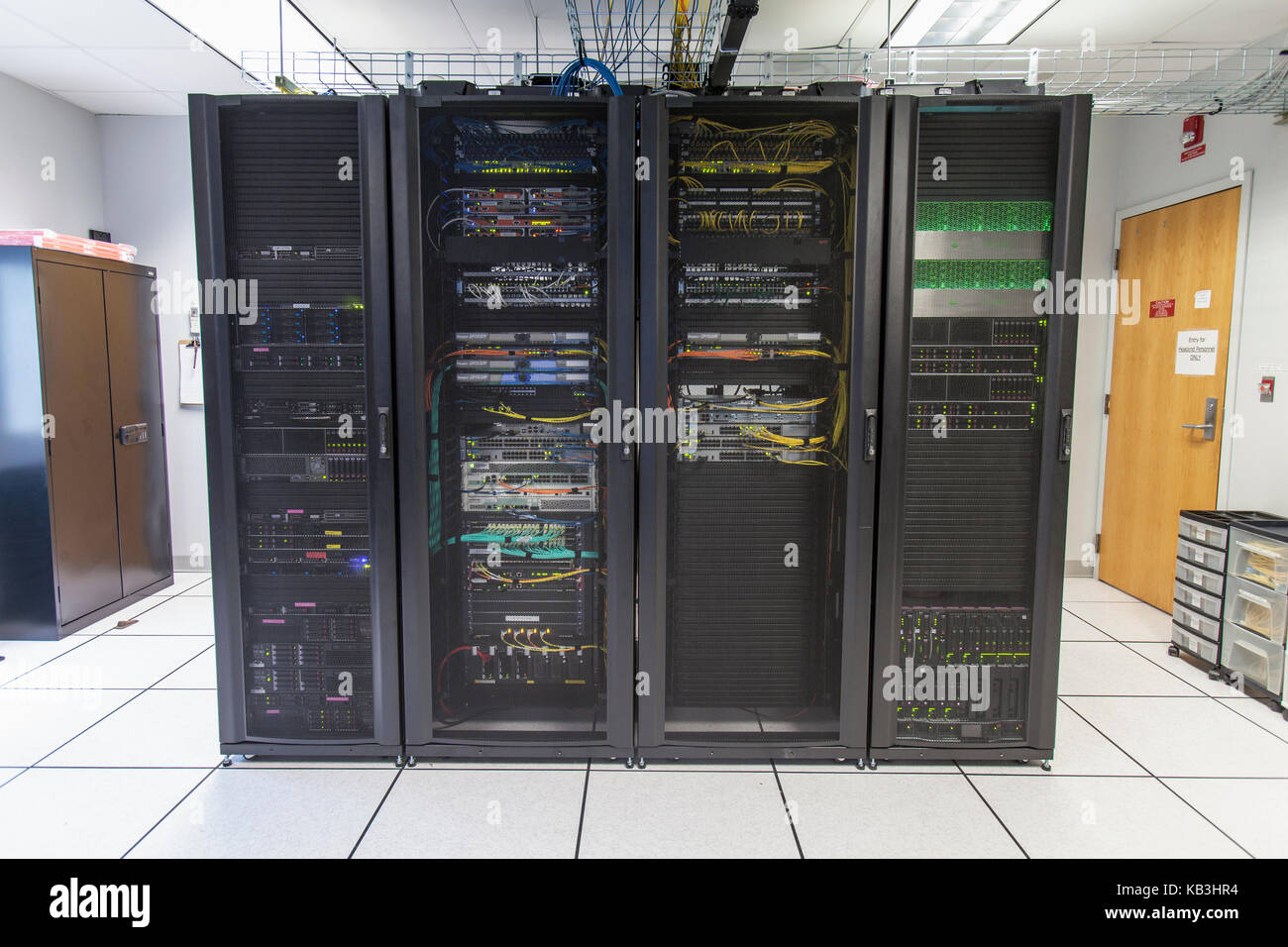 Racks of network equipment in communications room Stock Photo