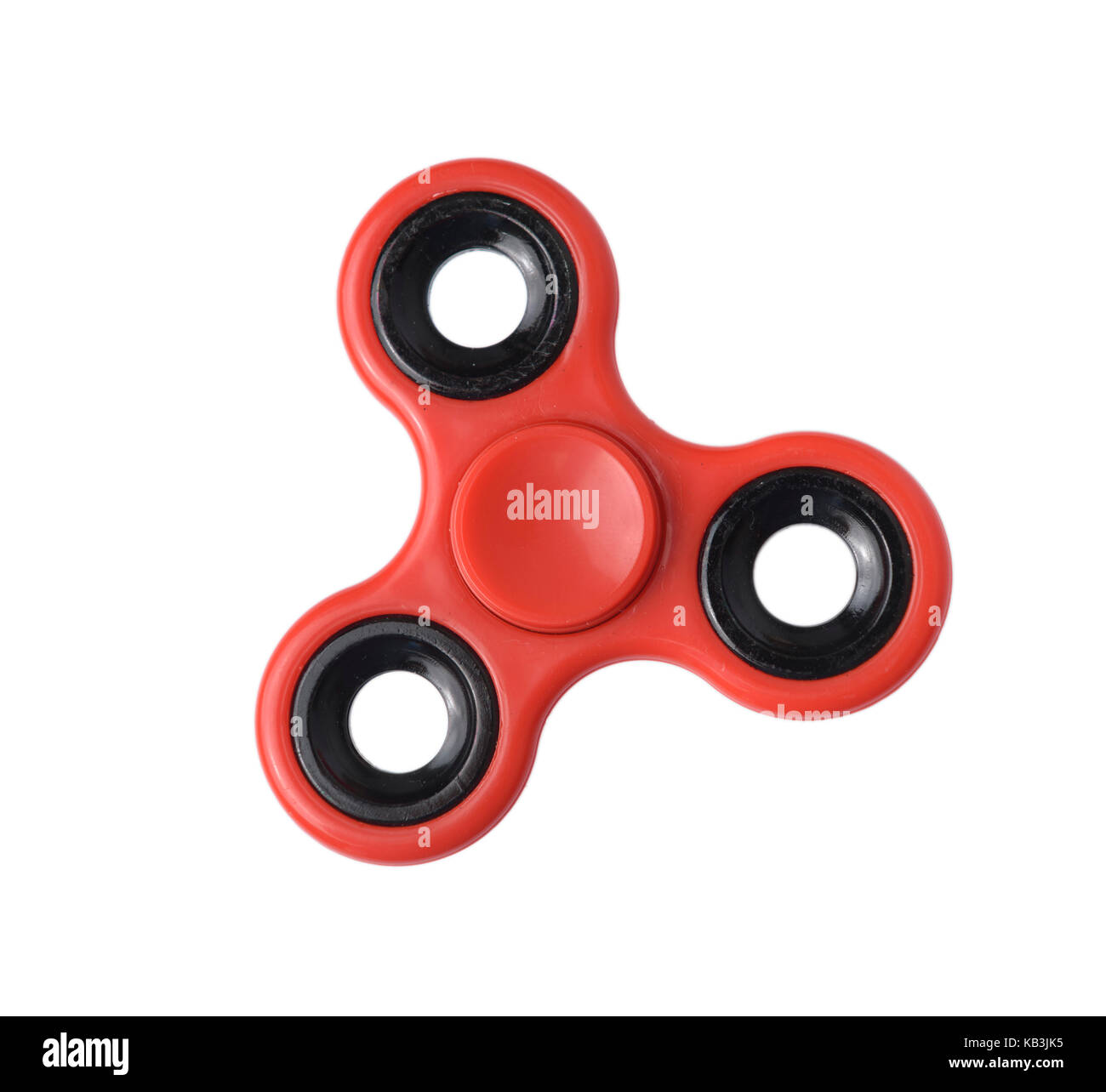 Red fidget spinner cut out isolated on white background Stock Photo