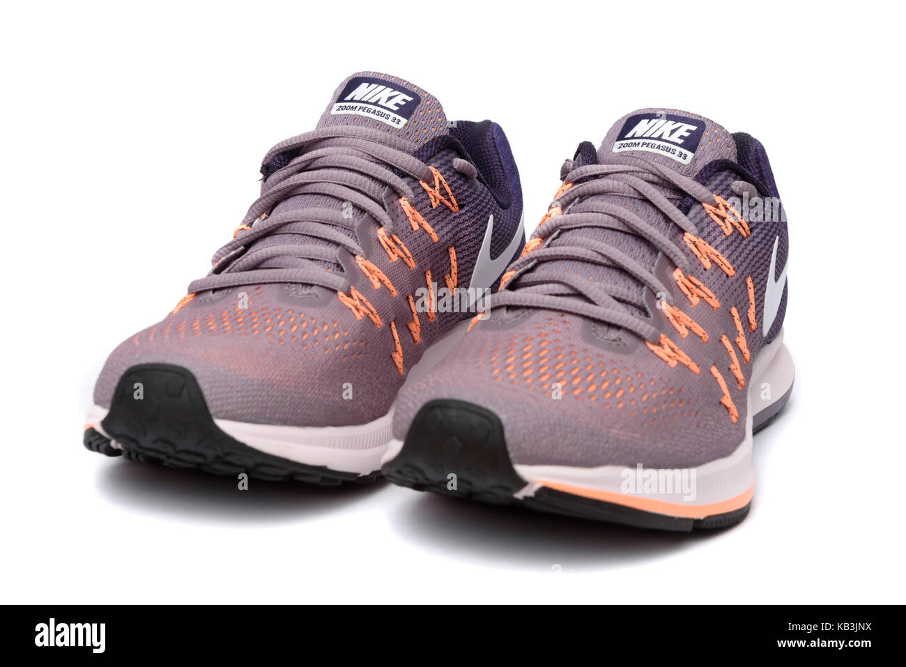 Purple and orange Nike Pegasus 33 running shoes cutout isolated on white  background Stock Photo - Alamy