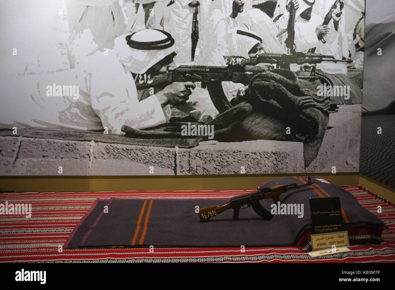 UAE, Abu Dhabi, Sheikh Zayed Research Center, photo of Sheikh Zayed bin Sultan with AK-47 rifle Stock Photo
