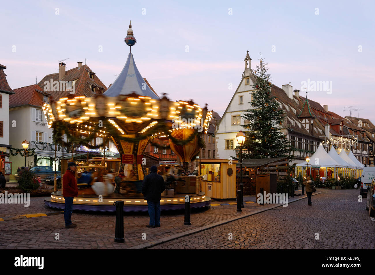 France, Bas Rhin, Obernai, Christmas market on market square, the Christmas tree and the old corn exchange house Stock Photo