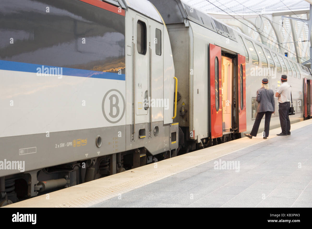 Train conductor and railroad engineer waiting on the platform Stock Photo Alamy