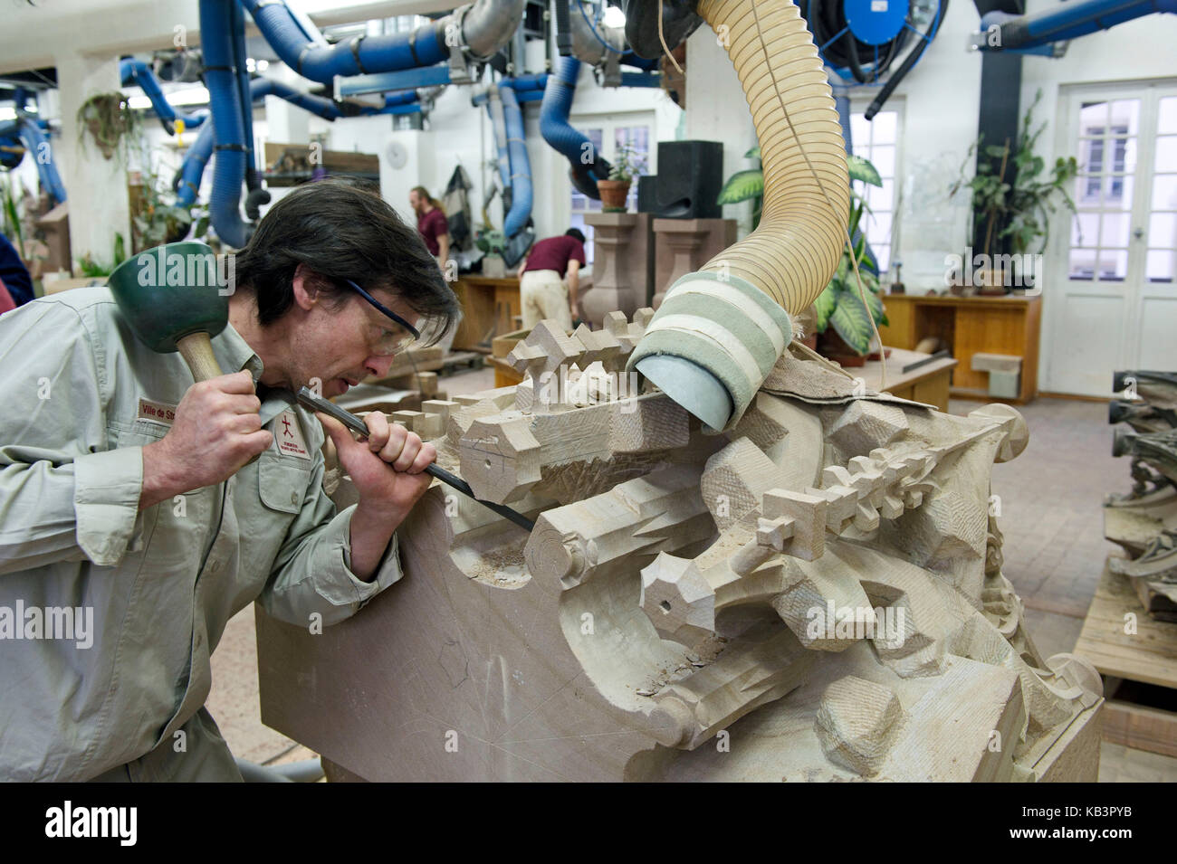France, Bas Rhin, Strasbourg, old town listed as World Heritage by UNESCO, A stone cutter in the workshop of the Oeuvre Notre Dame Stock Photo