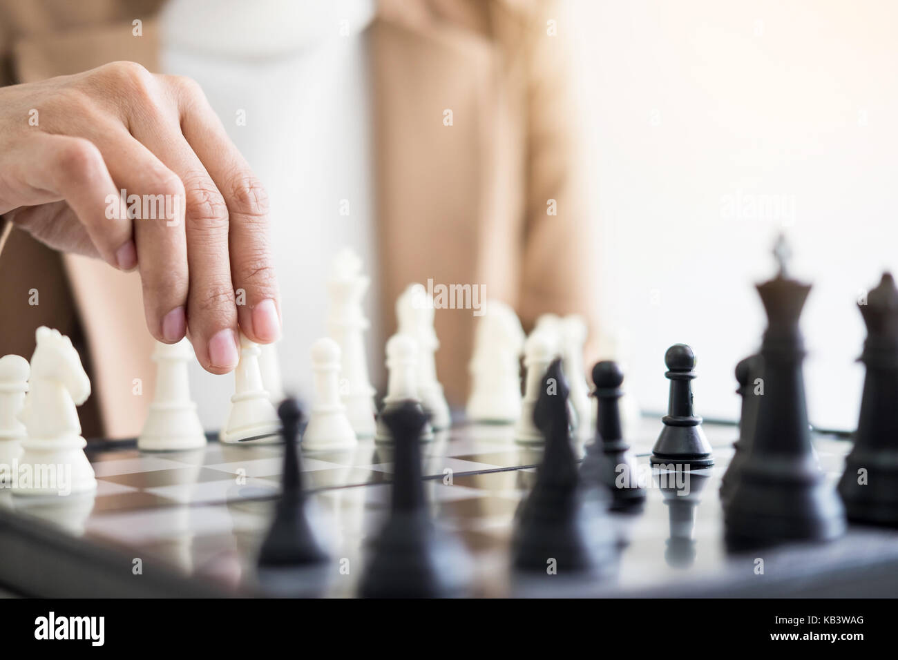 Two business women play chess hi-res stock photography and images - Alamy