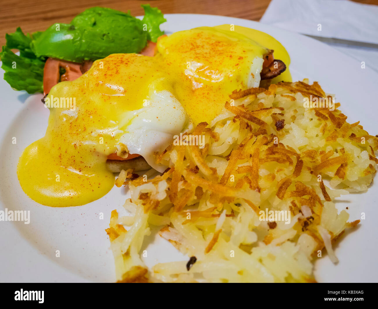 Delicious egg benedict serve with hash brown, ate at Los Angeles, California, United States