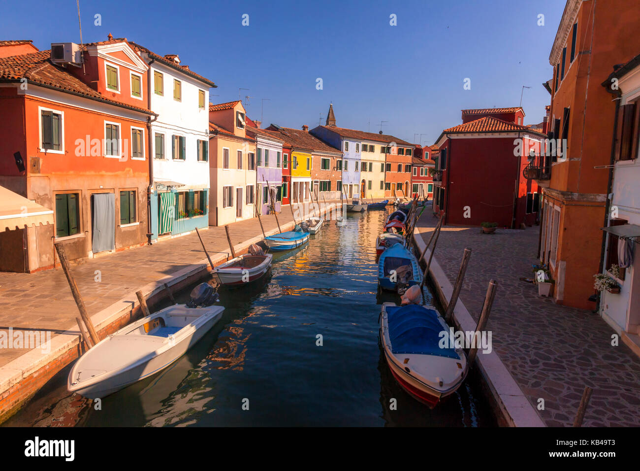 Canal scene in the colorful Italian island of Burano, located just off Venice, Italy Stock Photo